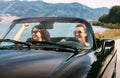 Two female friends travel in cabriolet car Royalty Free Stock Photo