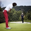 Two female golfer on green Royalty Free Stock Photo