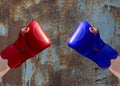 Two female hands in red and blue boxing gloves Royalty Free Stock Photo