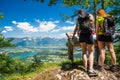 Two female hikers enjoying gorgeous view over Lake Bled and Alps on summer day Royalty Free Stock Photo