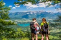 Two female hikers enjoying gorgeous view over Lake Bled and Alps on summer day Royalty Free Stock Photo