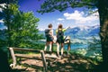 Two female hikers enjoying gorgeous view over Lake Bled and Alps on summer day Royalty Free Stock Photo