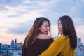 Two female lesbian lgbt couple celebrate anniversary with champaign at roof top party in sunset evening time,love wins concept