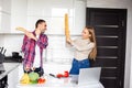 Two female and male competitors struggle for winning culinary contest, target at each other have irritated and furious expressions