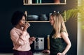 Two female office colleagues talking together during a break Royalty Free Stock Photo