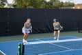 Two Female Pickleball Players at the Baseline