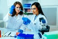 Two female scientists or researchers conducting scientific research on medical plant in science lab Royalty Free Stock Photo