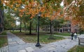 Two female students cross the quad on the Old Campus at Yale University in autumn.