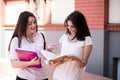 Two female students preparing for exams together outdoors Royalty Free Stock Photo