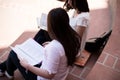 Two female students preparing for exams together outdoors Royalty Free Stock Photo