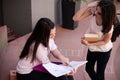 Two female students preparing for exams together outdoors Royalty Free Stock Photo