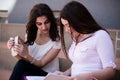 Two female students preparing for exams together outdoors Royalty Free Stock Photo