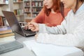 Two female students studying at the library Royalty Free Stock Photo
