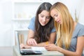 Two female students using laptop Royalty Free Stock Photo