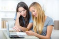 Two female students using laptop Royalty Free Stock Photo