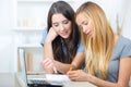 Two female students using laptop Royalty Free Stock Photo