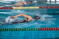 Two female swimmers during a race in the freestyle swim discipline