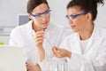 Two Female Technicians Working In Laboratory