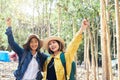 Two female travelers enjoy touring in the wild Royalty Free Stock Photo