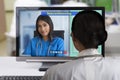 Two females doctor using teleconference technology to discutsion about patient case Royalty Free Stock Photo