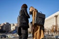 Two females with fashionable eco backpack and bag