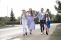 Two females mothers sisters business women  going for  walk with  a children girls in summer sun hat Royalty Free Stock Photo