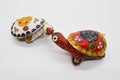 Two feng-shui colored metal turtles with detachable carapace shell for jewelry depositing