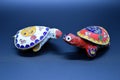 Two feng-shui colored metal turtles with detachable carapace shell for jewelry depositing on dark background Royalty Free Stock Photo