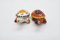 Two feng-shui colored metal turtles with detachable carapace shell for jewelry depositing Royalty Free Stock Photo