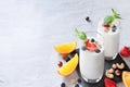 Two fermented drink kefir glasses and nuts, berries, citrus fruits with immune boosting properties white background with