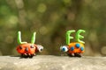 Two figures of ladybirds made of plasticine. Next to it is the inscription life