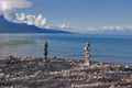 Two figures - pyramids from coastal stones Royalty Free Stock Photo