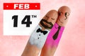 Fingers with cartoon man face painted as happy and free homosexual couple in love celebrating Valentines day in gay rights