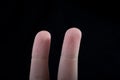 Two fingers of a human hand partly seen in view Royalty Free Stock Photo