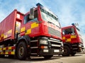 Two fire department vehicles parked on standby ready for deployment Royalty Free Stock Photo