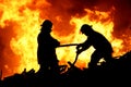 Two fire fighters and flames Royalty Free Stock Photo