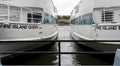 Two Fire Island ferry boats close together docked in Bay Shore