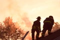 Two firefighters fighting a fire Royalty Free Stock Photo