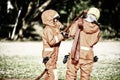Two firefighters help arrange the water tube to fight the fire. Firefighter prepare dress up and equipment for firefighting Royalty Free Stock Photo
