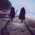 Two Fisherman dry their fishing net