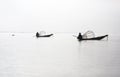 Two fishermen on canoes with fishing traps, Inle l Royalty Free Stock Photo