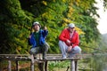 Two fishermen catch fish standing on the bridge Royalty Free Stock Photo