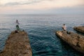 Fishermen at sunset on the seashore in Havana. Cuba Royalty Free Stock Photo