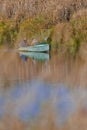 Two Fishermen in Fishing Boat At Pripyat River in Polesye resort