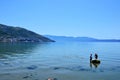 Two fishermen with fishing net at the Adriatic sea coast in the city of Vlore / Vlora, Albania Royalty Free Stock Photo