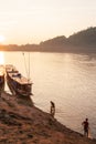 Two fishermen with fishing nets in the Mekong River at sunset. S Royalty Free Stock Photo