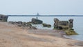 Two fishermen fishing from the ruins of northern fort in Liepaja, Latvia