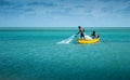 Two fishermen fishing in the sea.