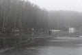 Two fishermen on the ice of a recently frozen pond Royalty Free Stock Photo