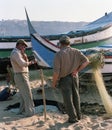 Two fishermen near boats in a small village of Portugal in the 80s Royalty Free Stock Photo
